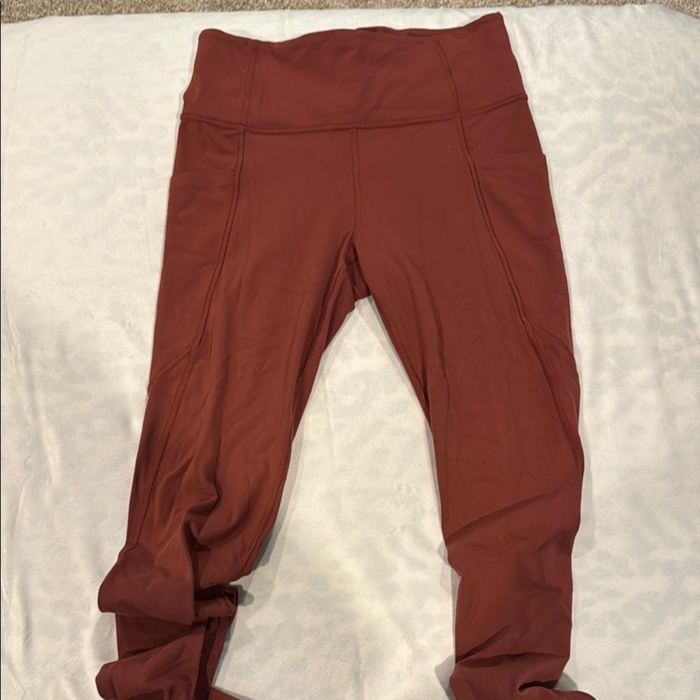 Athleta dark rose/rust Leggings, size medium tall, new condition